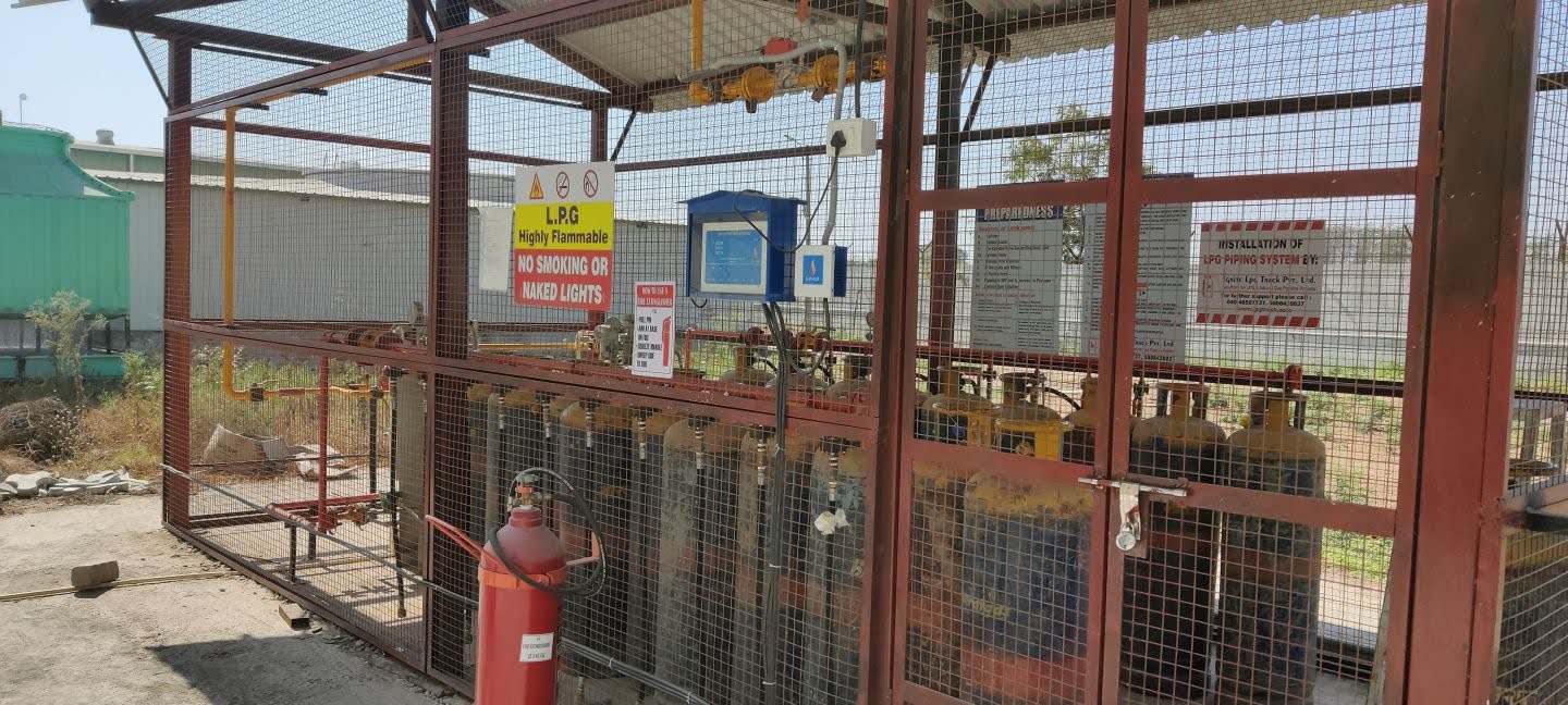 IGNITE LPG TRACK installed LPG cylinder bank with safety signage at a client plant